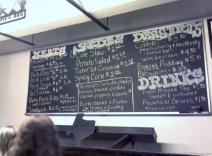 Opie's BBQ Menu chalkboard photo includes pricing.jpg