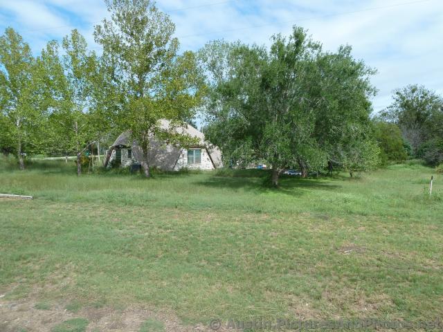 Semisphere house at Burnet Texas seen from train.jpg