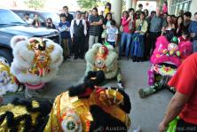 Lion Dance performers take a break sitting on the ground.jpg