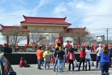 Ronald McDonald reaches into his magic bag while on stage at Chinatown Austin.jpg