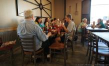 Customers enjoying food sitting inside Schmidt Family BBQ restaurant Bee Cave.jpg