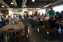 Lines surround bench tables inside Schmidt Family BBQ Restaurant.jpg